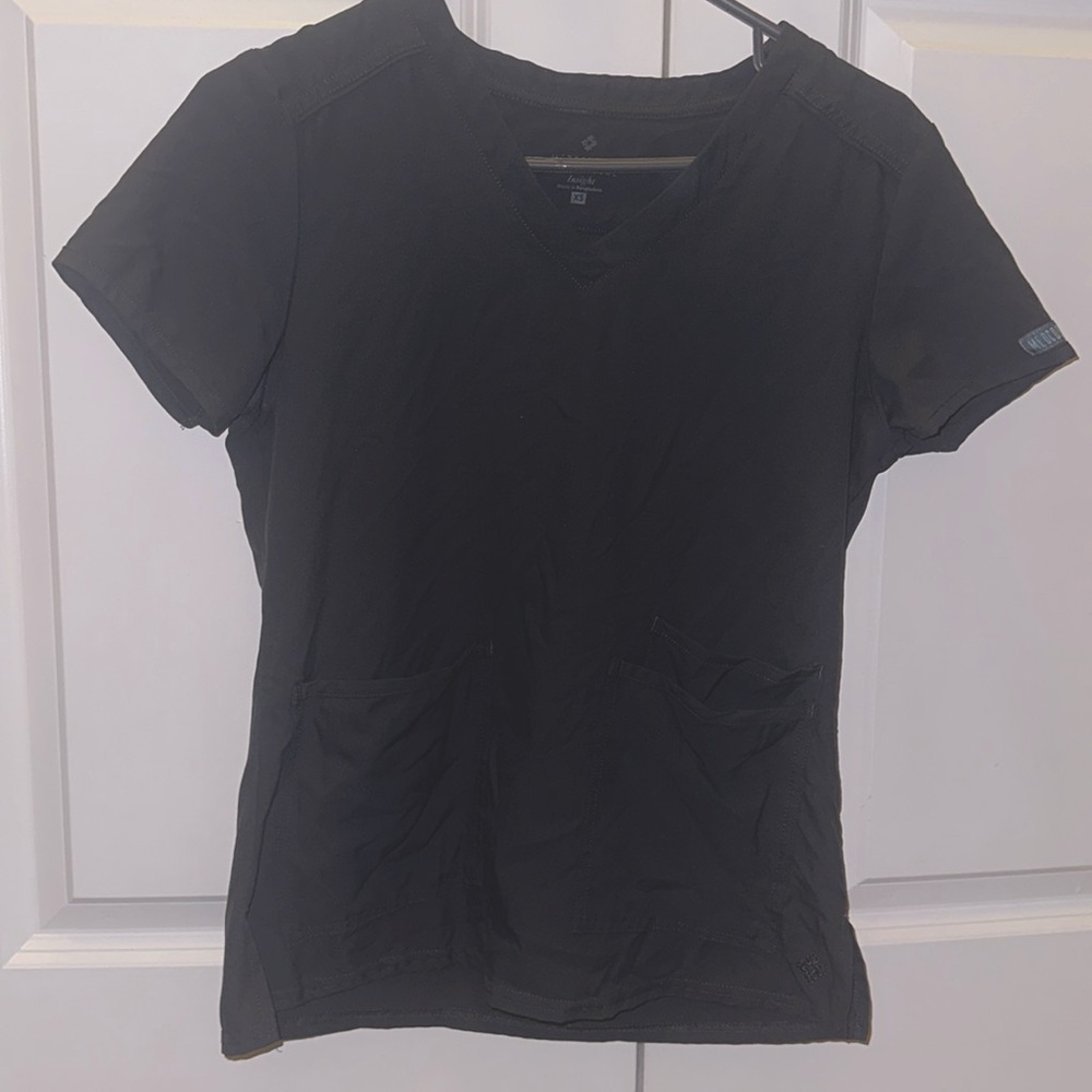 Grey medcouture scrub top. Two pockets in front.